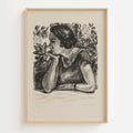 A framed charcoal portrait print of a woman in profile, shown against a light neutral background. The artwork is rendered in dark charcoal on warm off-white paper, enclosed in a light natural wood frame.